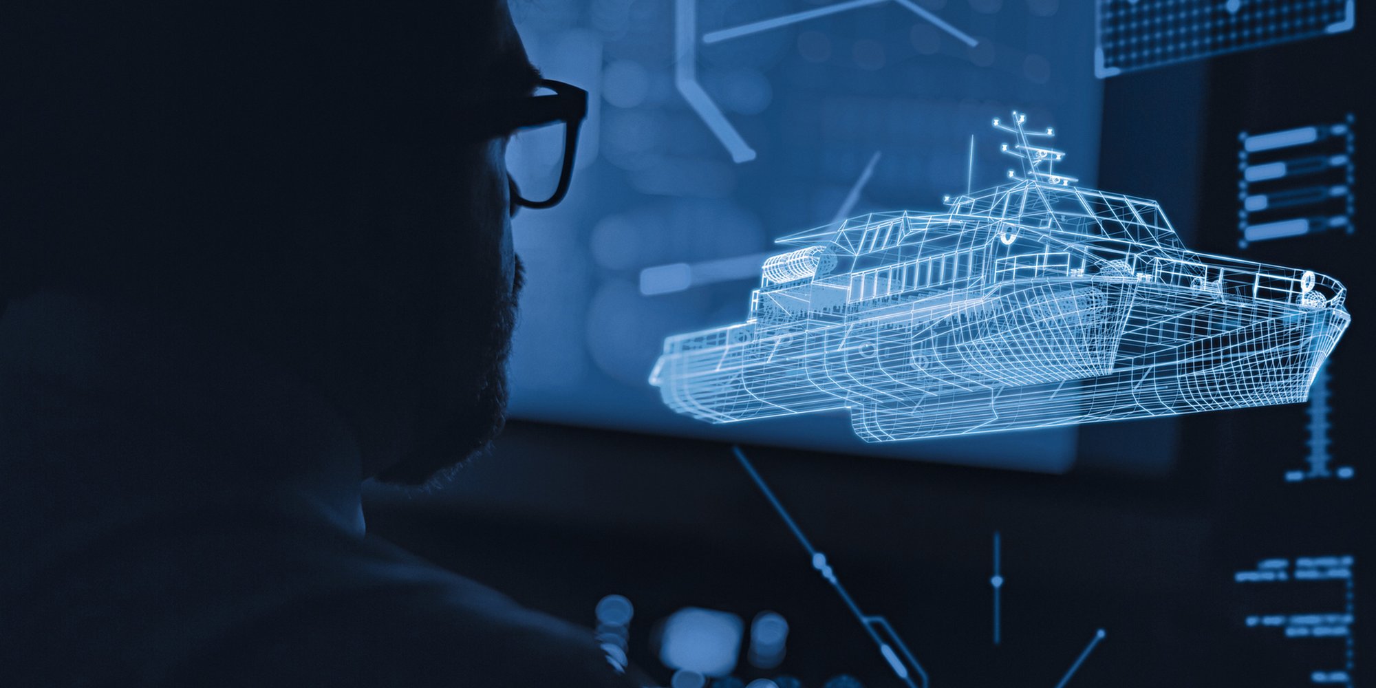Digitalt hologram av fartygsdesign projiceras på skärm i mörkt rum.